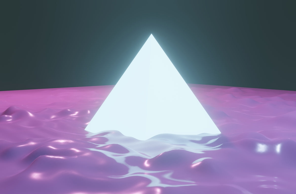 a triangle shaped object floating on top of a body of water
