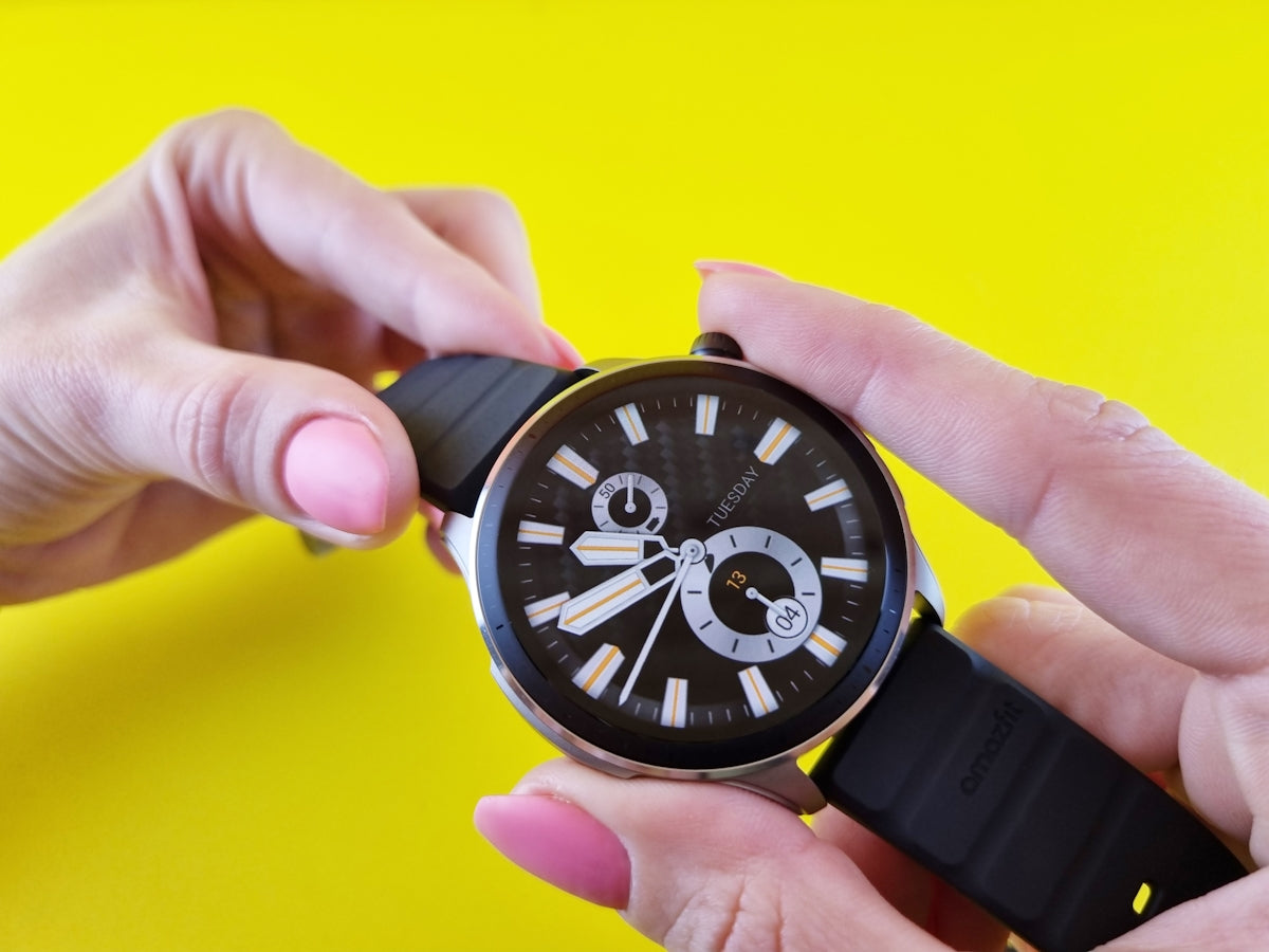 a person holding a couple of watches